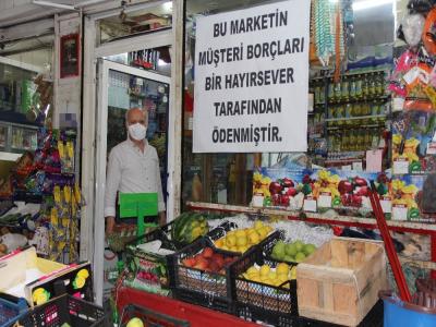 MAHALLENİN BORÇLARINI KAPATTI