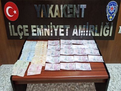PİYASAYA SAHTE PARA SÜRERKEN YAKALANDI